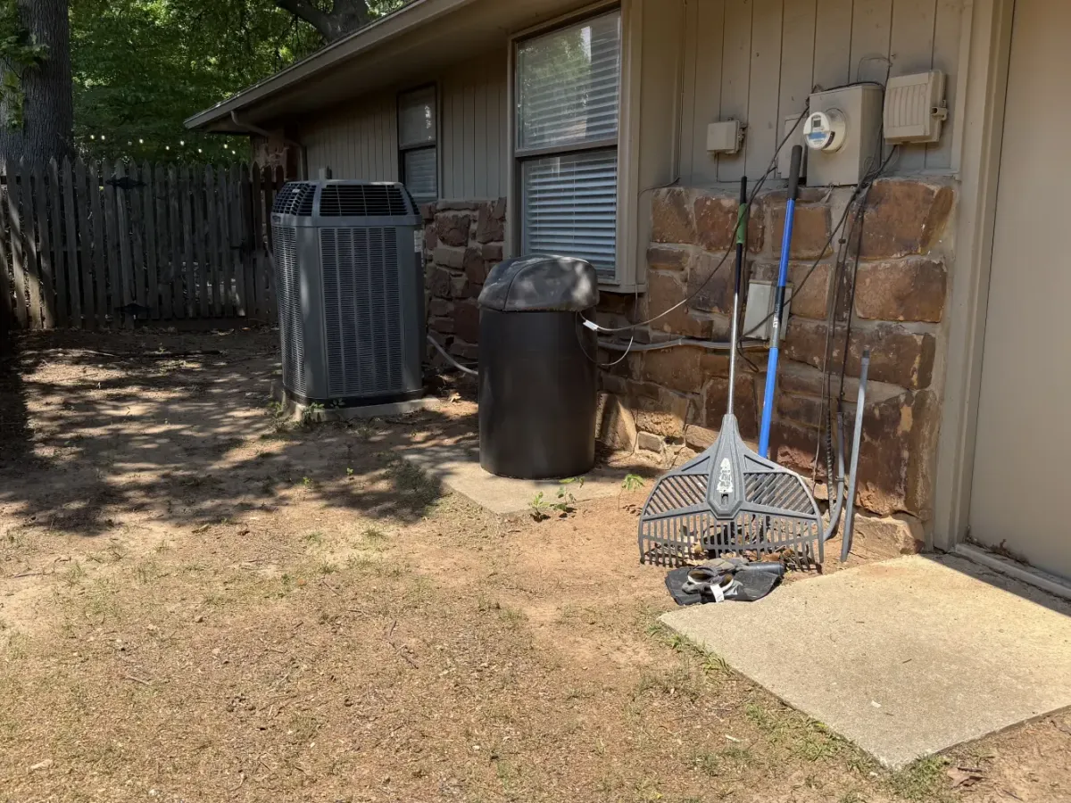 Yard cleared of leaves and fence line debris after a fall cleanup